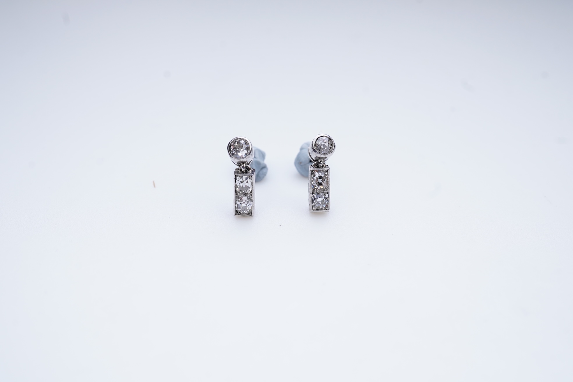 A pair of diamond earrings, early 20th century composite